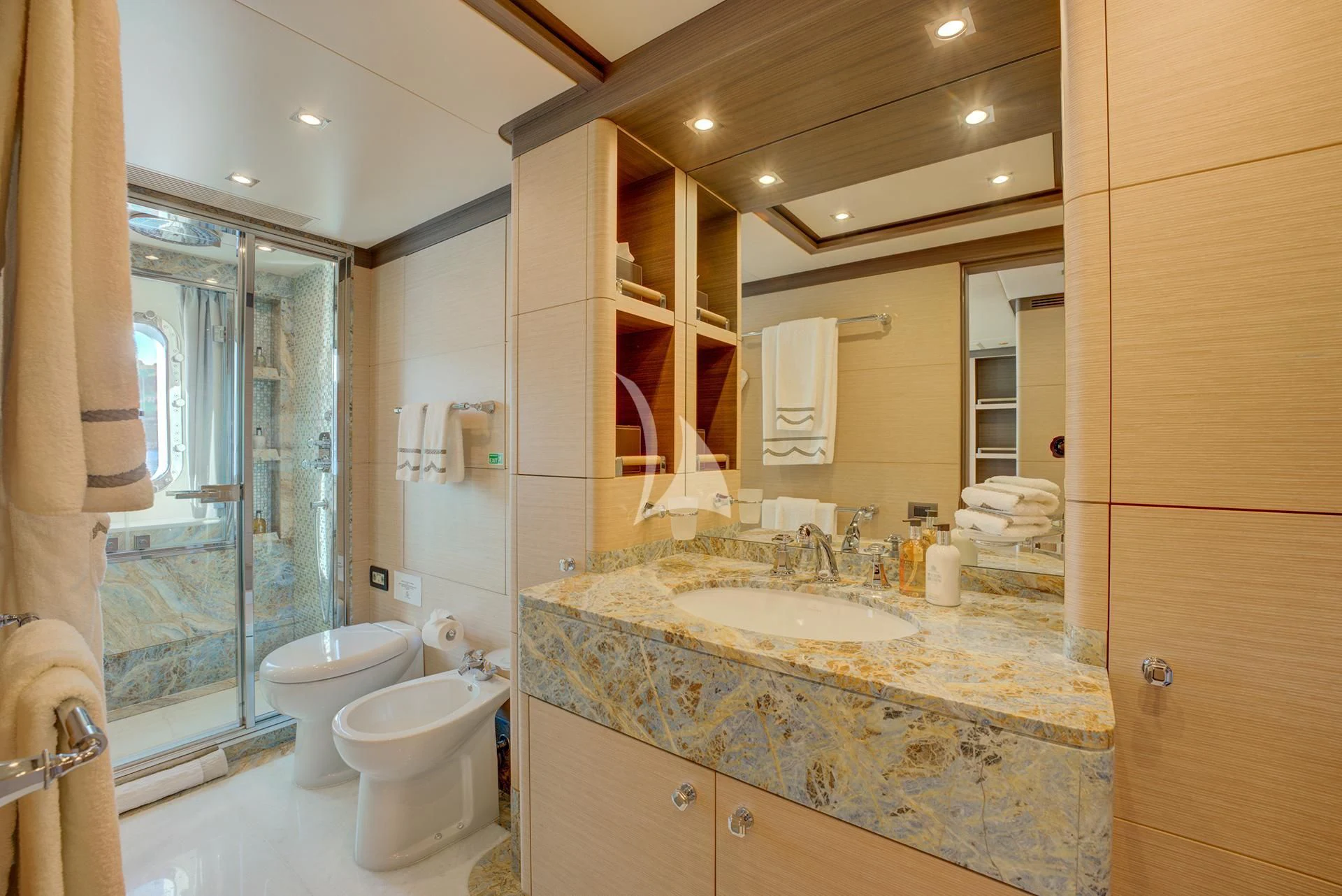 a bathroom with a large mirror aboard NELA Yacht for Charter