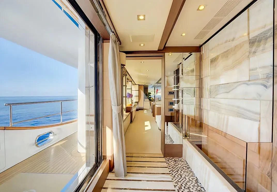 a hallway with glass doors aboard NELA Yacht for Charter