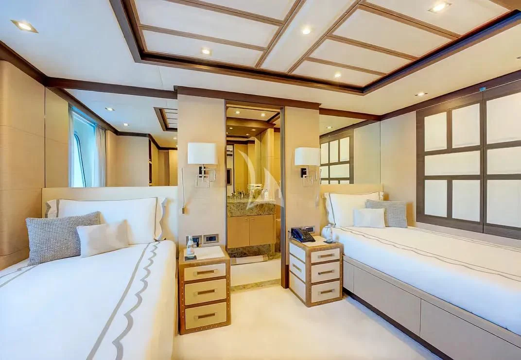 a room with a bed and a mirror aboard NELA Yacht for Charter