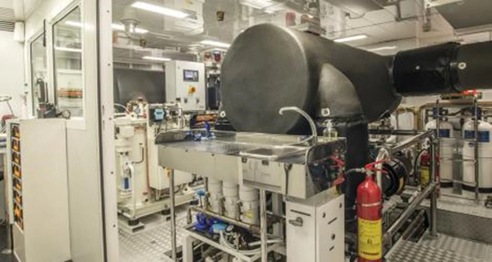 a large machine in a room aboard NELA Yacht for Charter