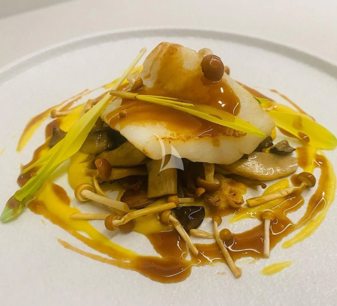 a plate of food aboard NELA Yacht for Charter