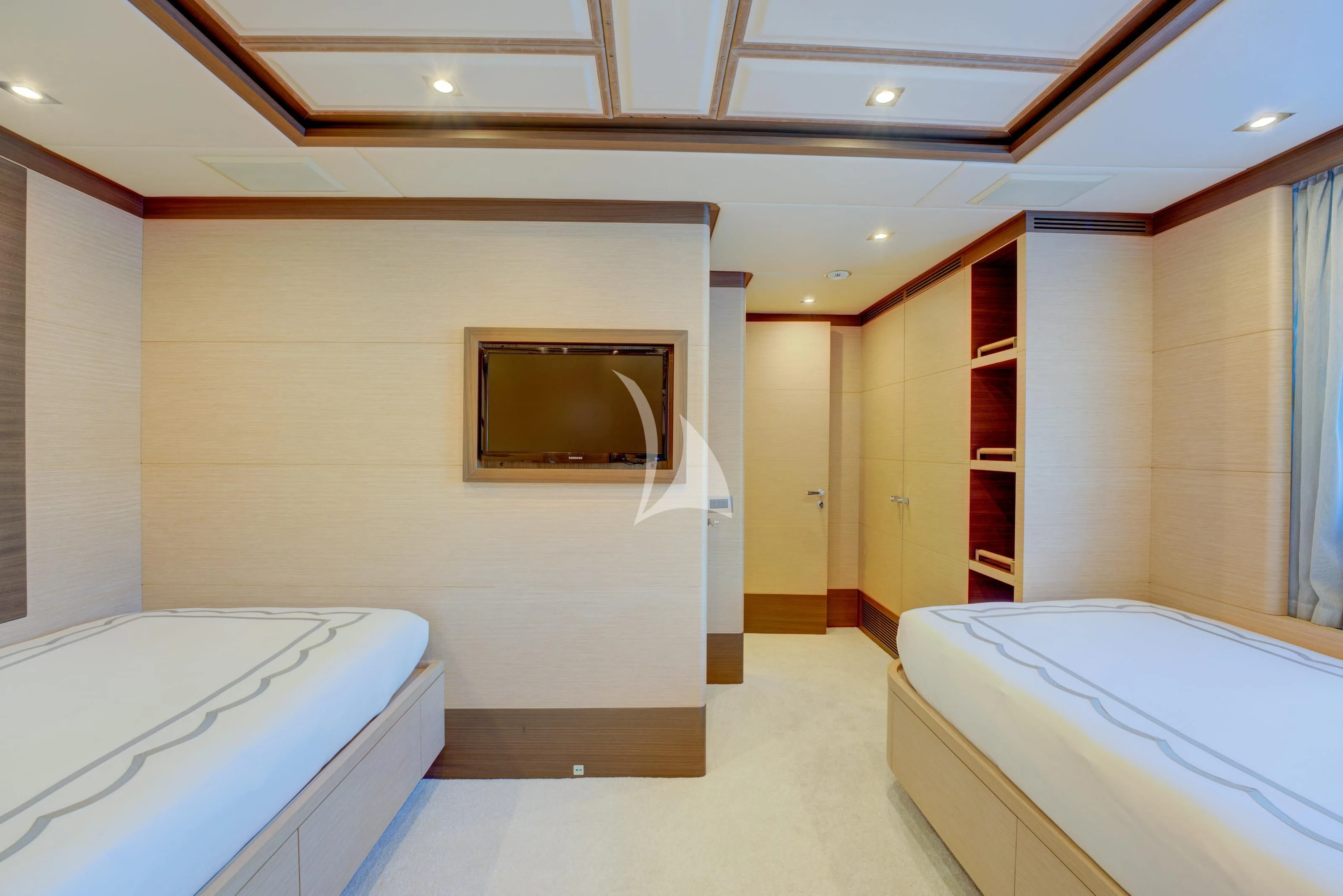 a room with a tv and a bed aboard NELA Yacht for Charter