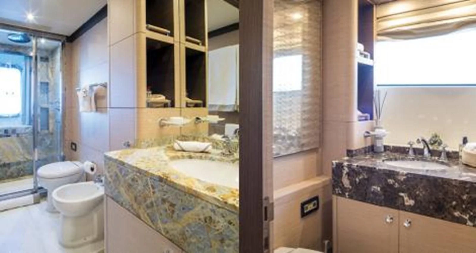 a bathroom with a large marble countertop aboard NELA Yacht for Charter