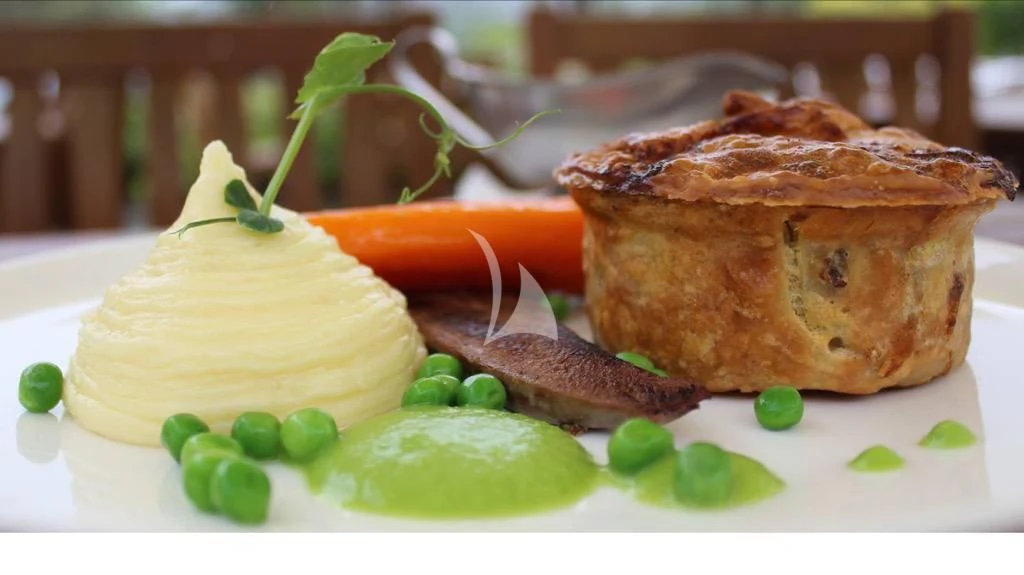 a plate of food aboard NELA Yacht for Charter