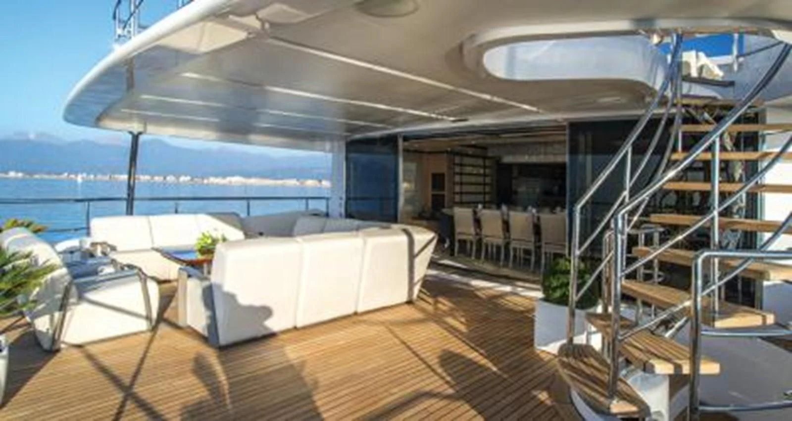 a room with a large balcony aboard NELA Yacht for Charter