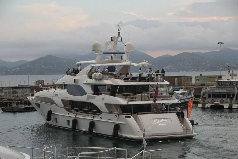 a large white boat in the water aboard NELA Yacht for Charter