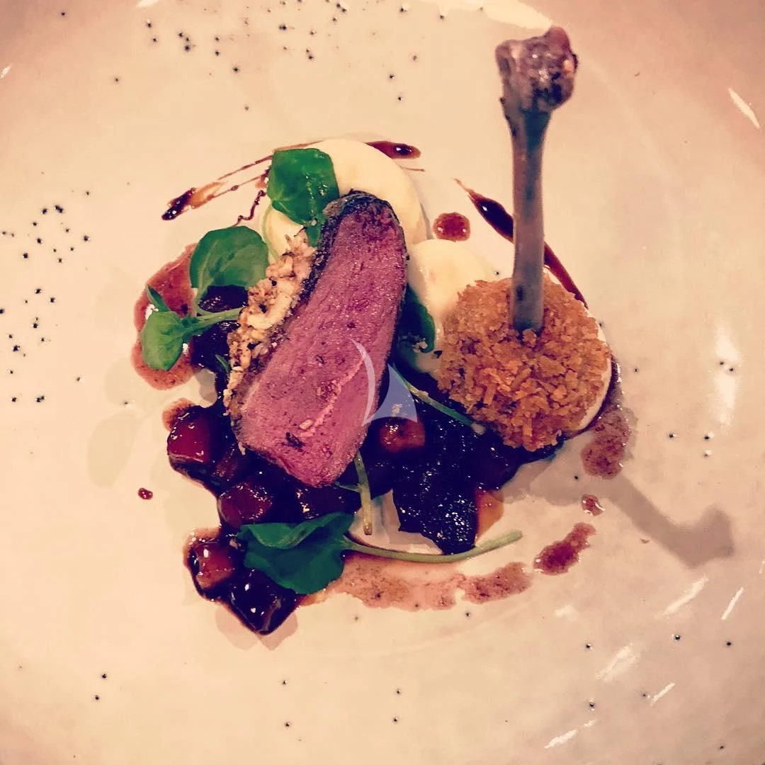 a plate of food aboard NELA Yacht for Charter