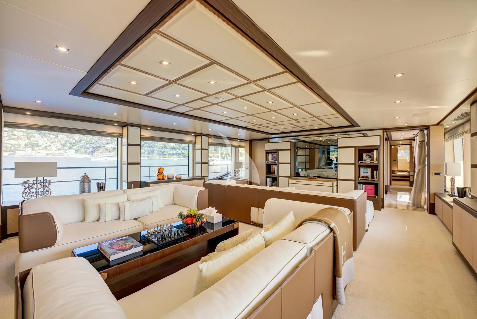 a living room with a large window aboard NELA Yacht for Charter
