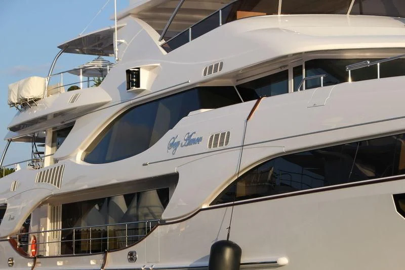 a yacht with a white roof aboard NELA Yacht for Charter