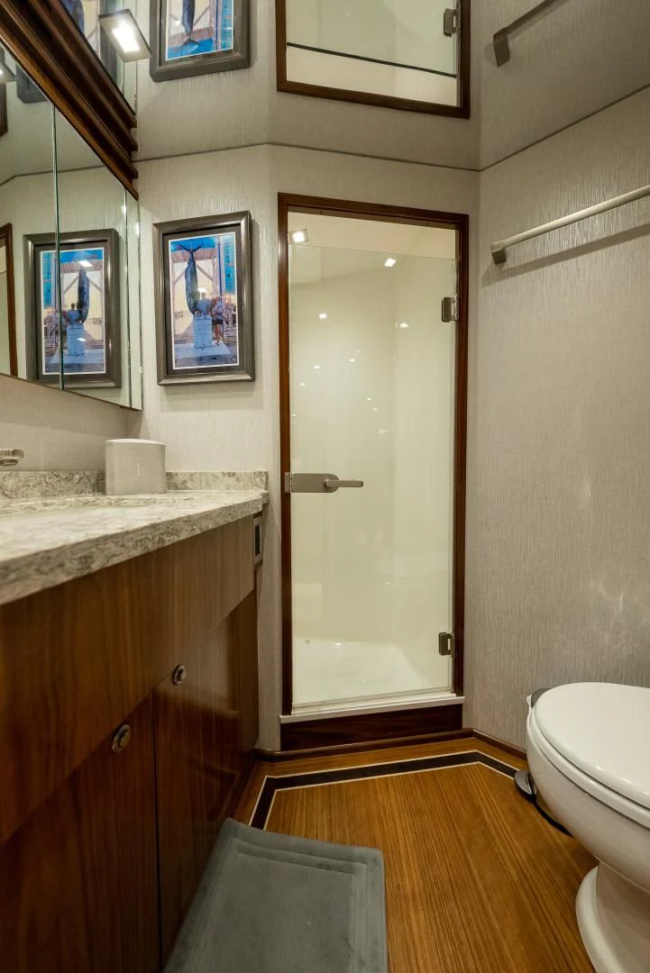 a bathroom with a glass door aboard IT JUST TAKES TIME Yacht for Sale