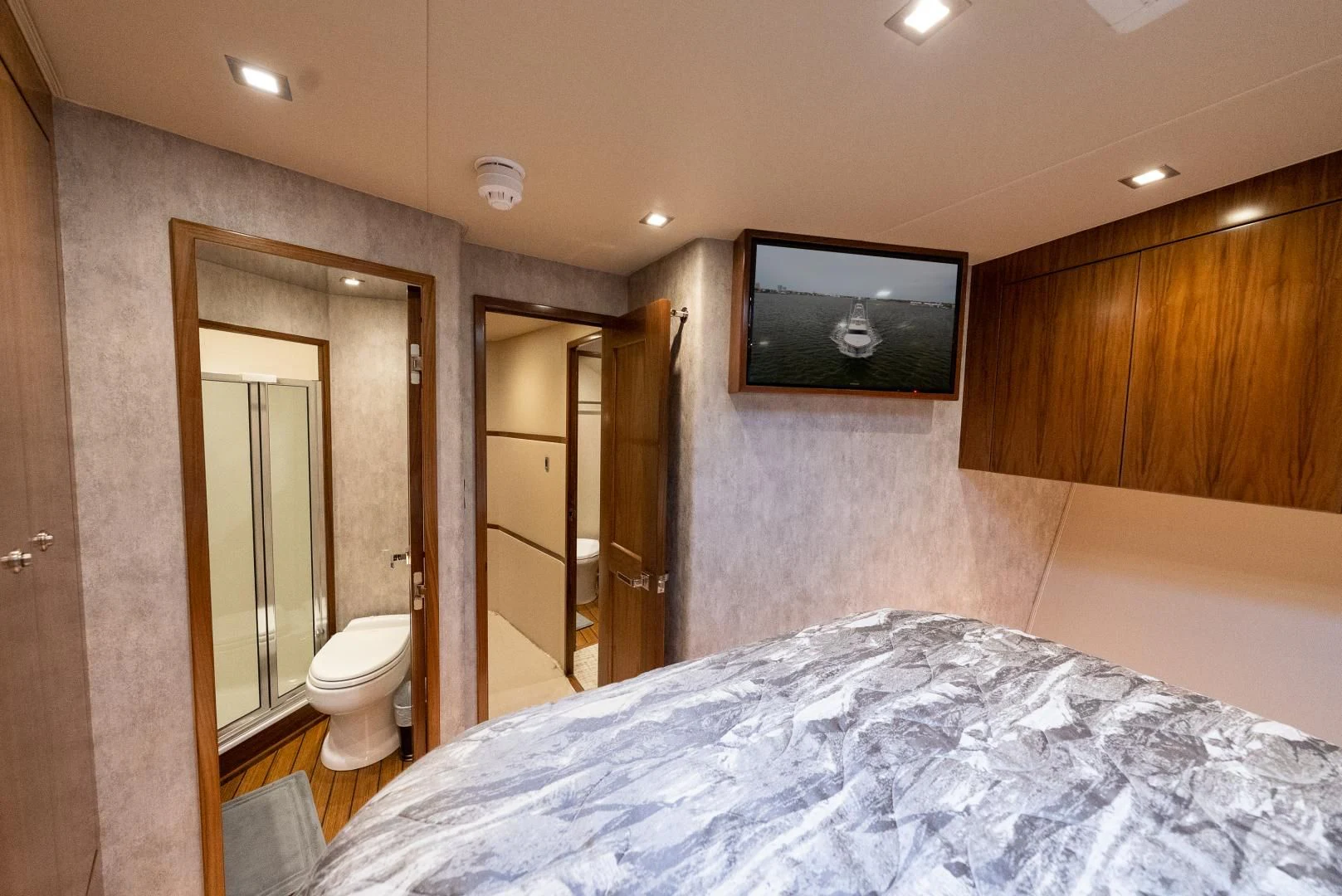a bathroom with a large bed aboard IT JUST TAKES TIME Yacht for Sale