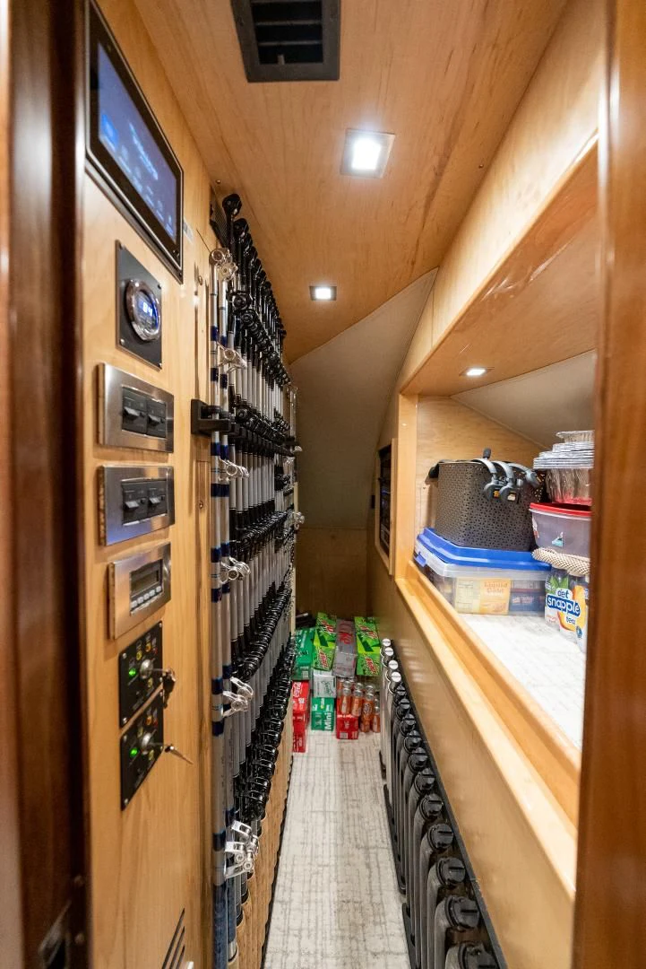 a room with shelves and a bed aboard IT JUST TAKES TIME Yacht for Sale