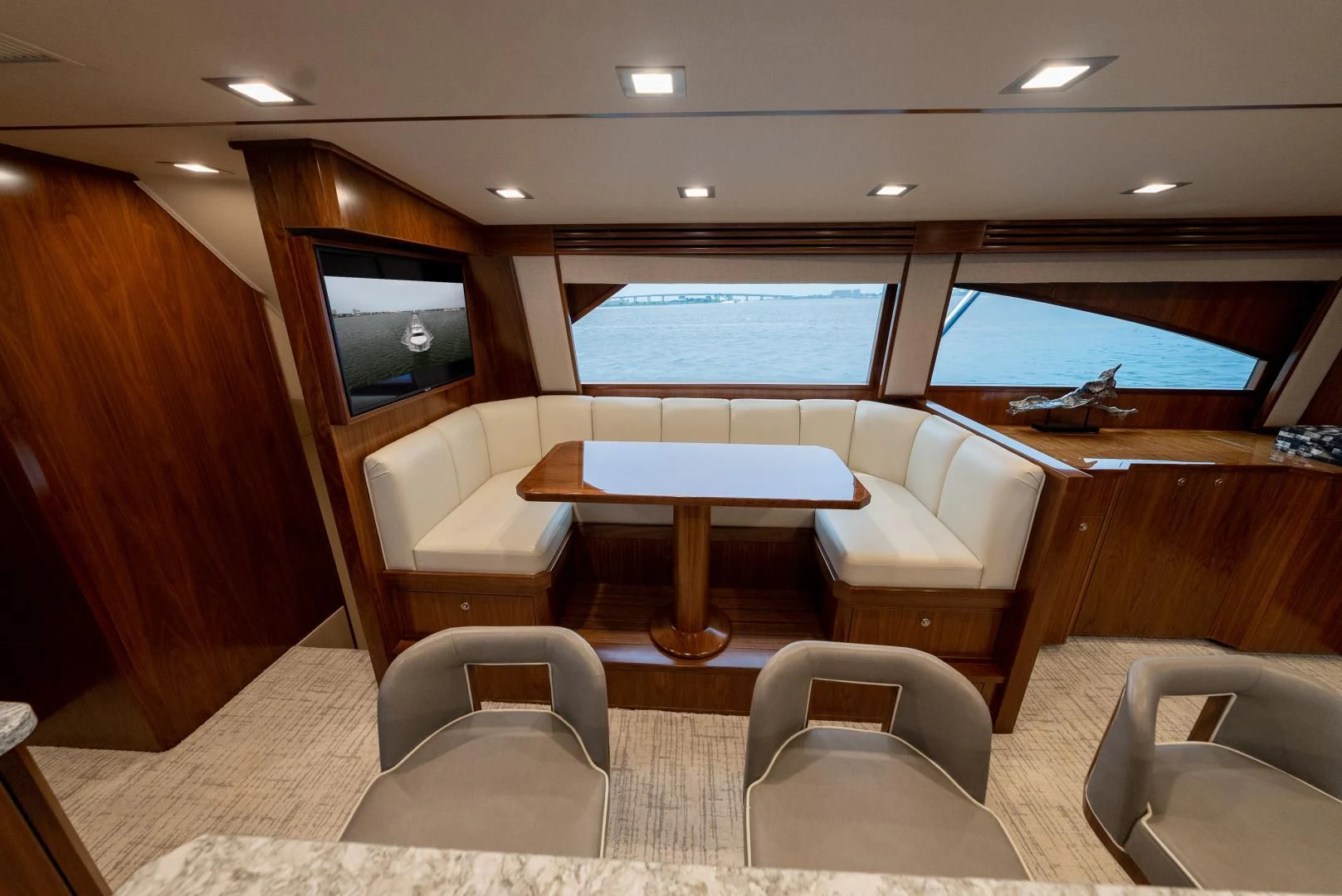 a room with a table and chairs aboard IT JUST TAKES TIME Yacht for Sale