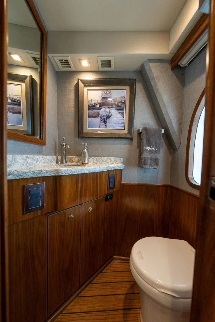 a bathroom with a sink and a toilet aboard IT JUST TAKES TIME Yacht for Sale