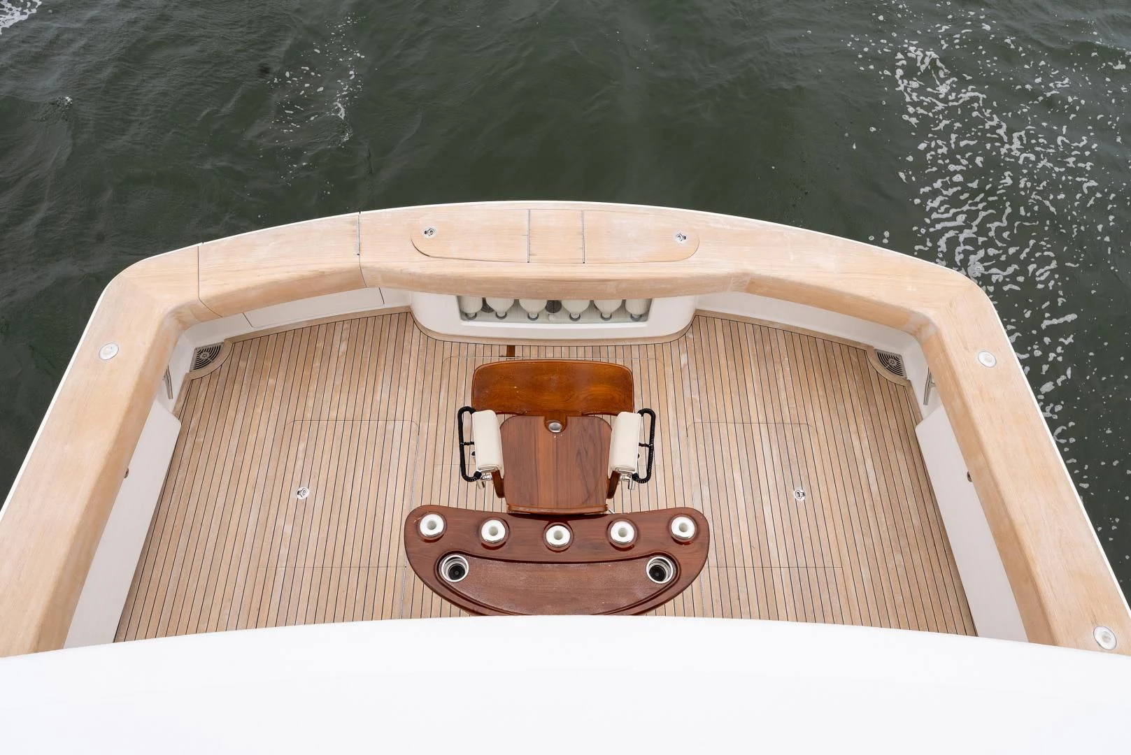 a wooden boat with a metal steering wheel on a body of water aboard IT JUST TAKES TIME Yacht for Sale
