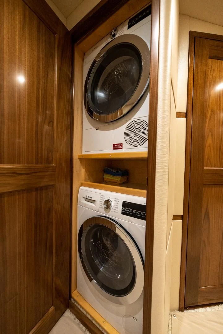 a washer and dryer in a closet aboard IT JUST TAKES TIME Yacht for Sale