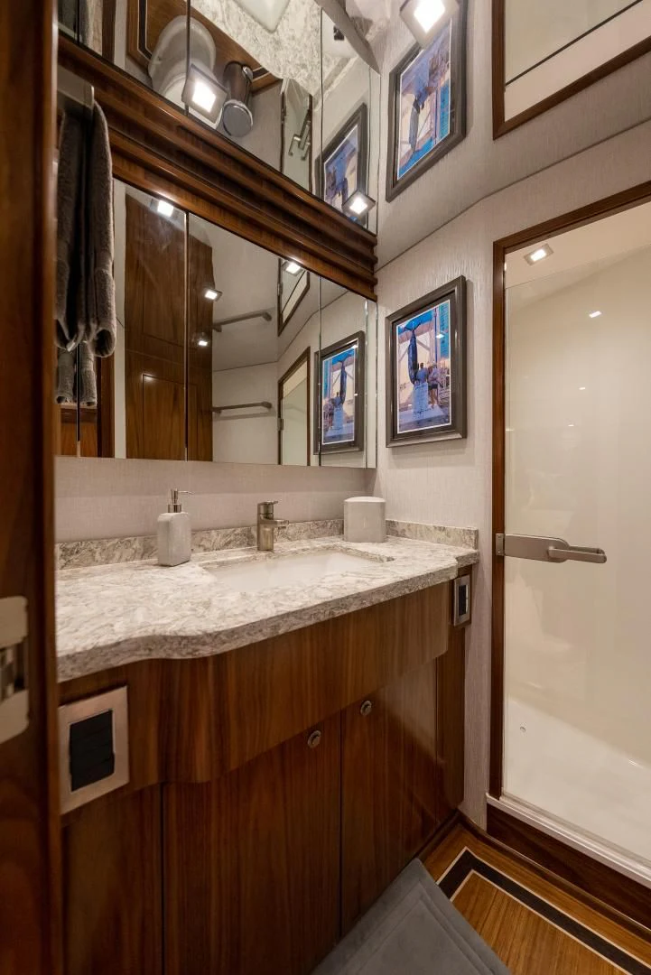 a bathroom with a large mirror aboard IT JUST TAKES TIME Yacht for Sale