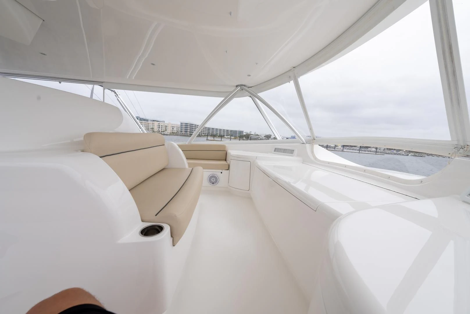 a room with a couch and a large window aboard IT JUST TAKES TIME Yacht for Sale