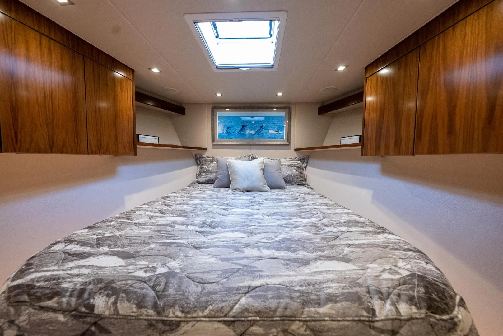 a bed with a blue comforter aboard IT JUST TAKES TIME Yacht for Sale