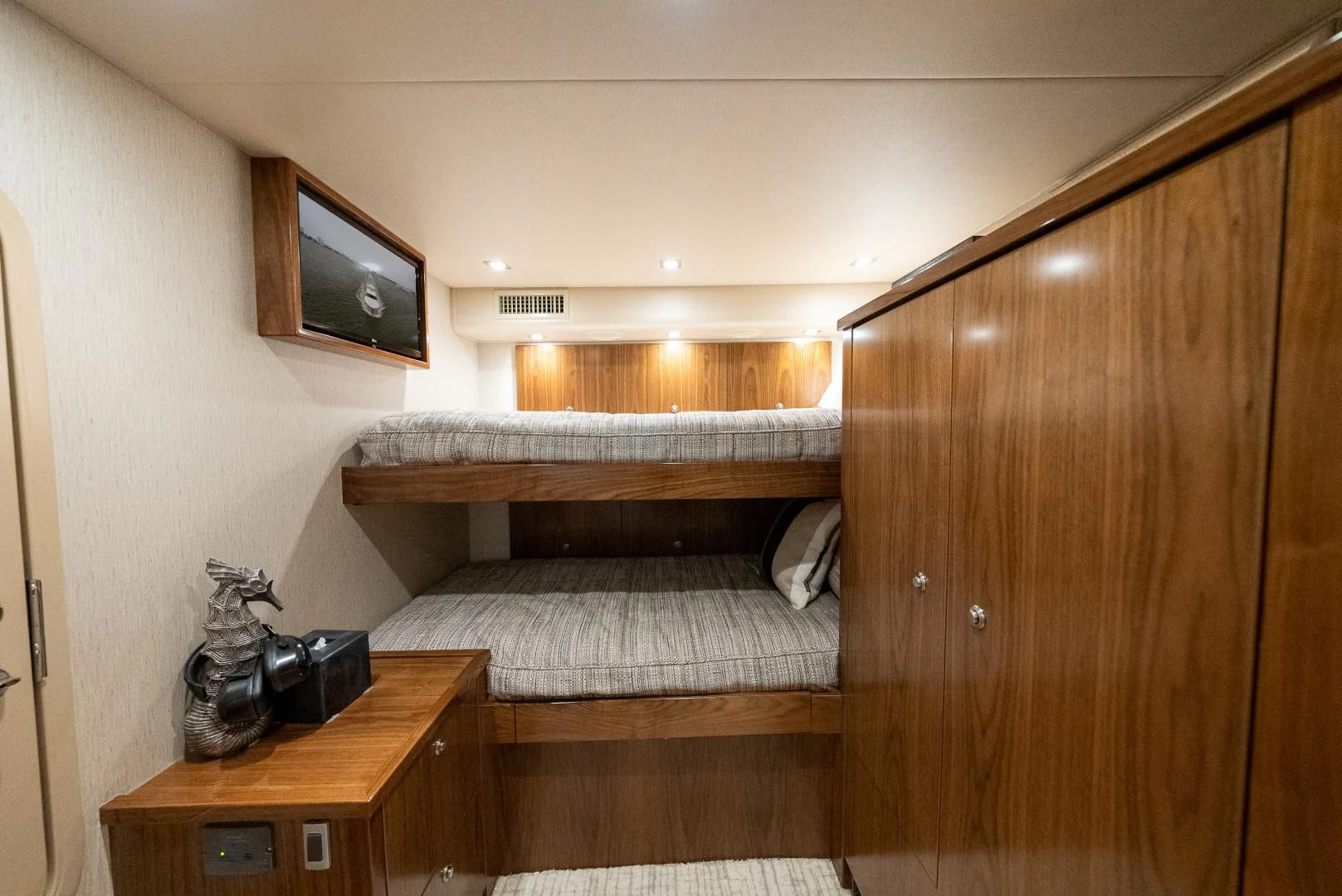 a bedroom with a wood cabinet aboard IT JUST TAKES TIME Yacht for Sale