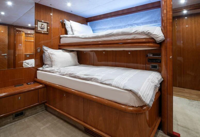 a bed with white sheets aboard SPACE ODDITY Yacht for Sale
