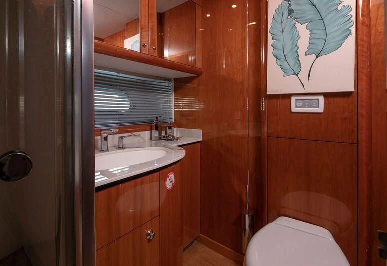 a bathroom with a sink and a toilet aboard SPACE ODDITY Yacht for Sale