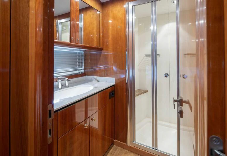 a bathroom with a glass shower aboard SPACE ODDITY Yacht for Sale