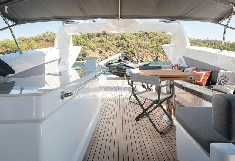a room with a table and chairs aboard SPACE ODDITY Yacht for Sale
