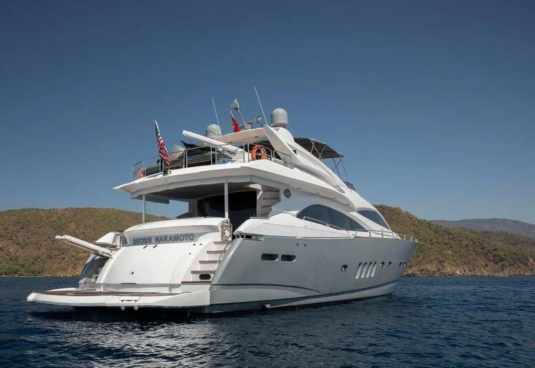 a white yacht on the water aboard SPACE ODDITY Yacht for Sale