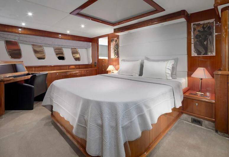 a large bed in a room aboard SPACE ODDITY Yacht for Sale