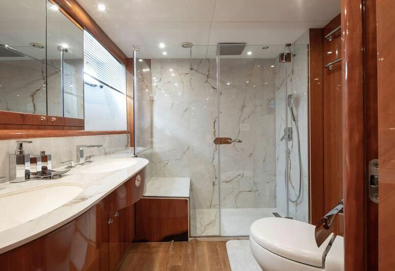 a bathroom with a shower and sink aboard SPACE ODDITY Yacht for Sale