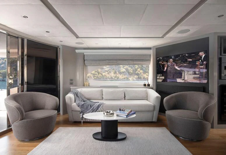 a living room with a large screen aboard SPACE ODDITY Yacht for Sale