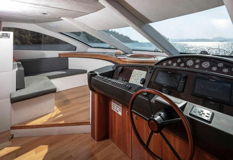 a car with a radio and a seat belt aboard SPACE ODDITY Yacht for Sale