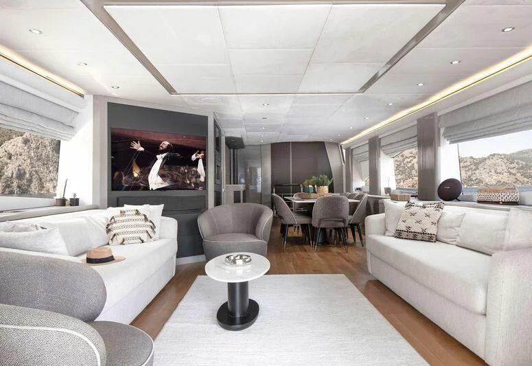 a living room with a large screen aboard SPACE ODDITY Yacht for Sale