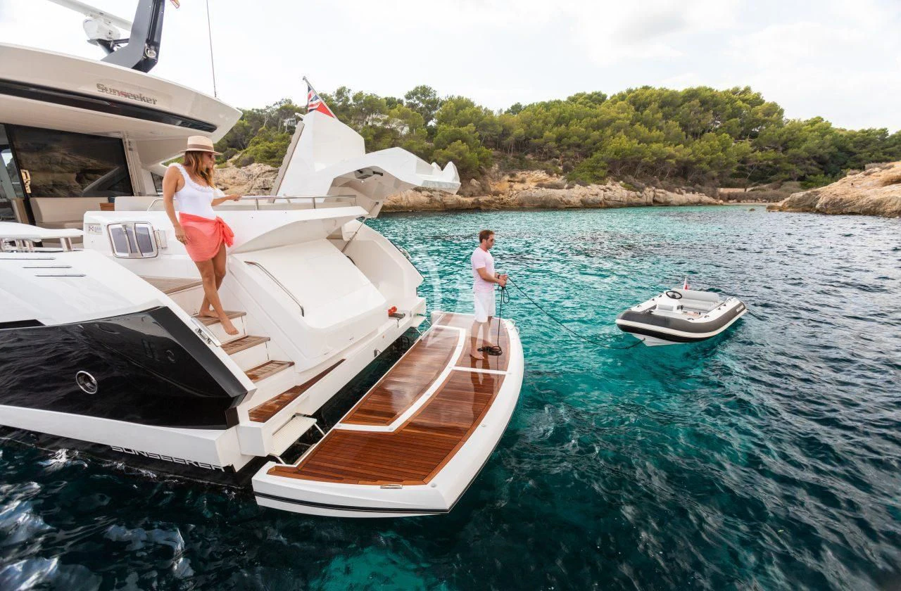 a couple of people on a boat aboard STRATEGIC DREAMS Yacht for Sale