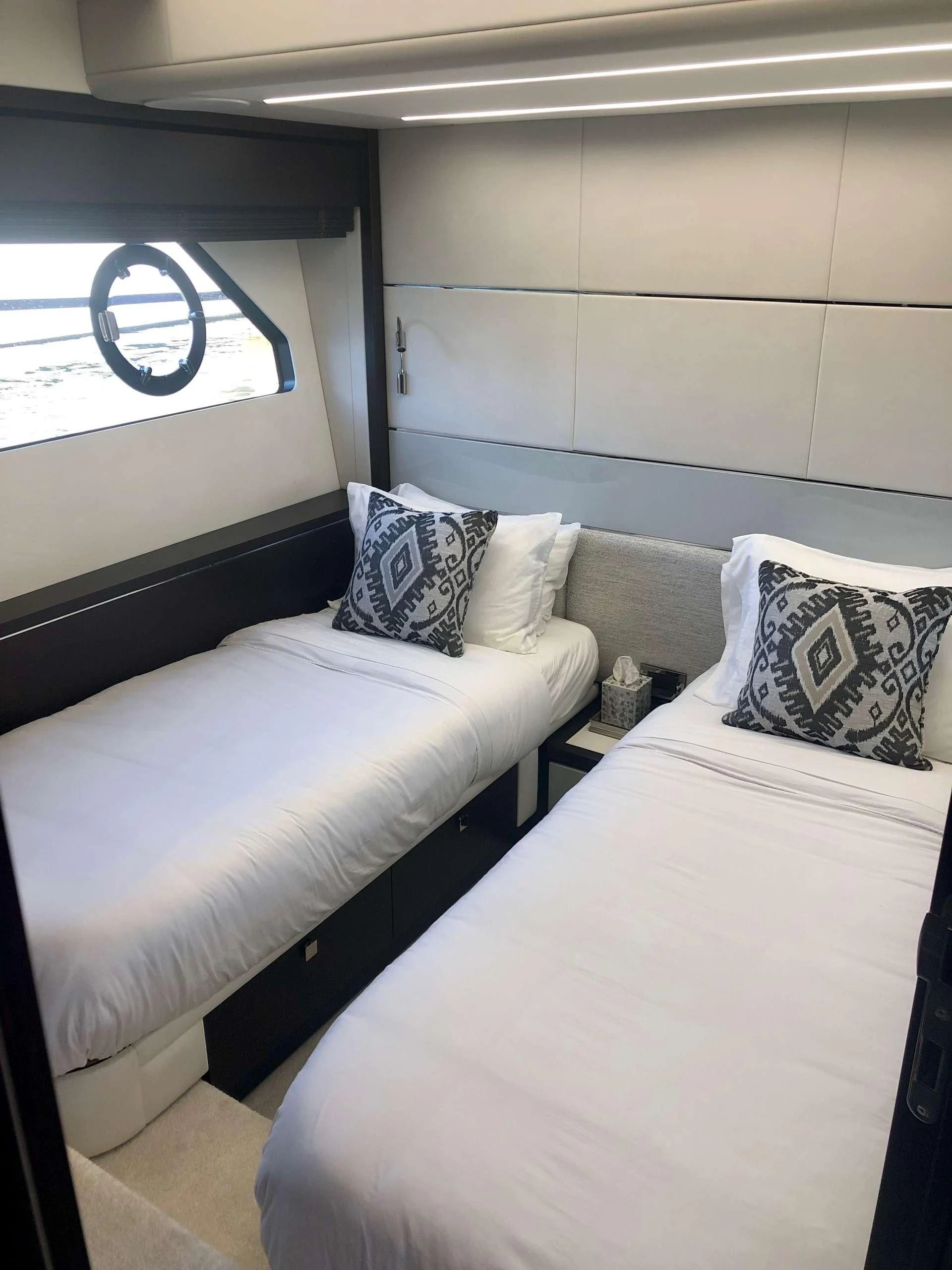 a room with a bed and a window aboard STRATEGIC DREAMS Yacht for Sale