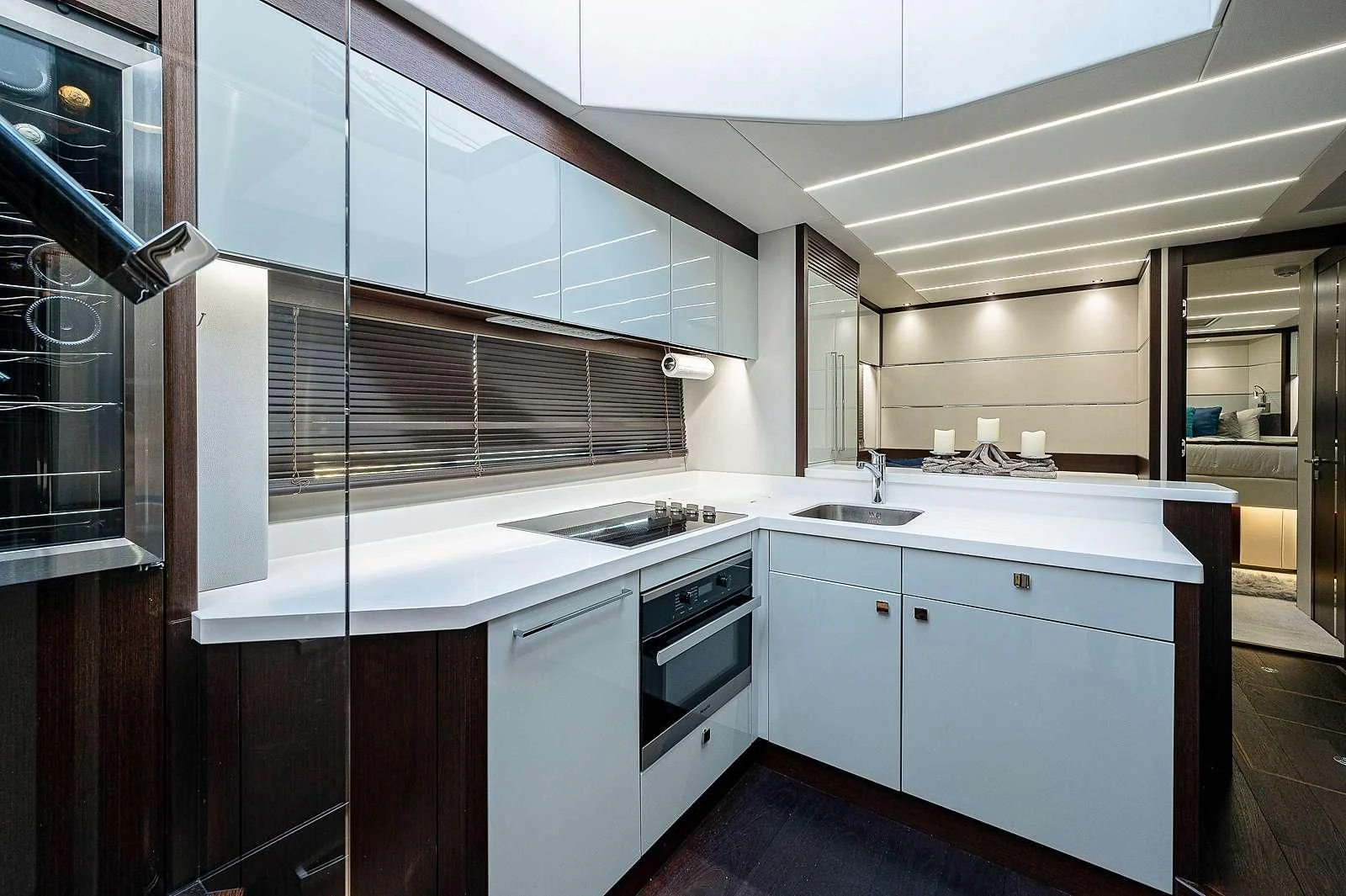 a kitchen with white cabinets aboard STRATEGIC DREAMS Yacht for Sale