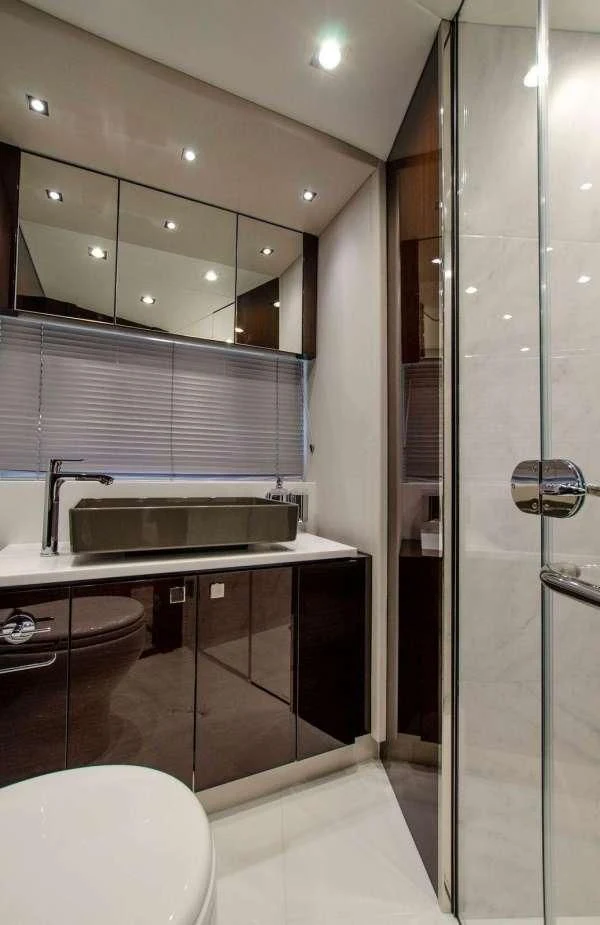 a bathroom with a glass shower aboard STRATEGIC DREAMS Yacht for Sale