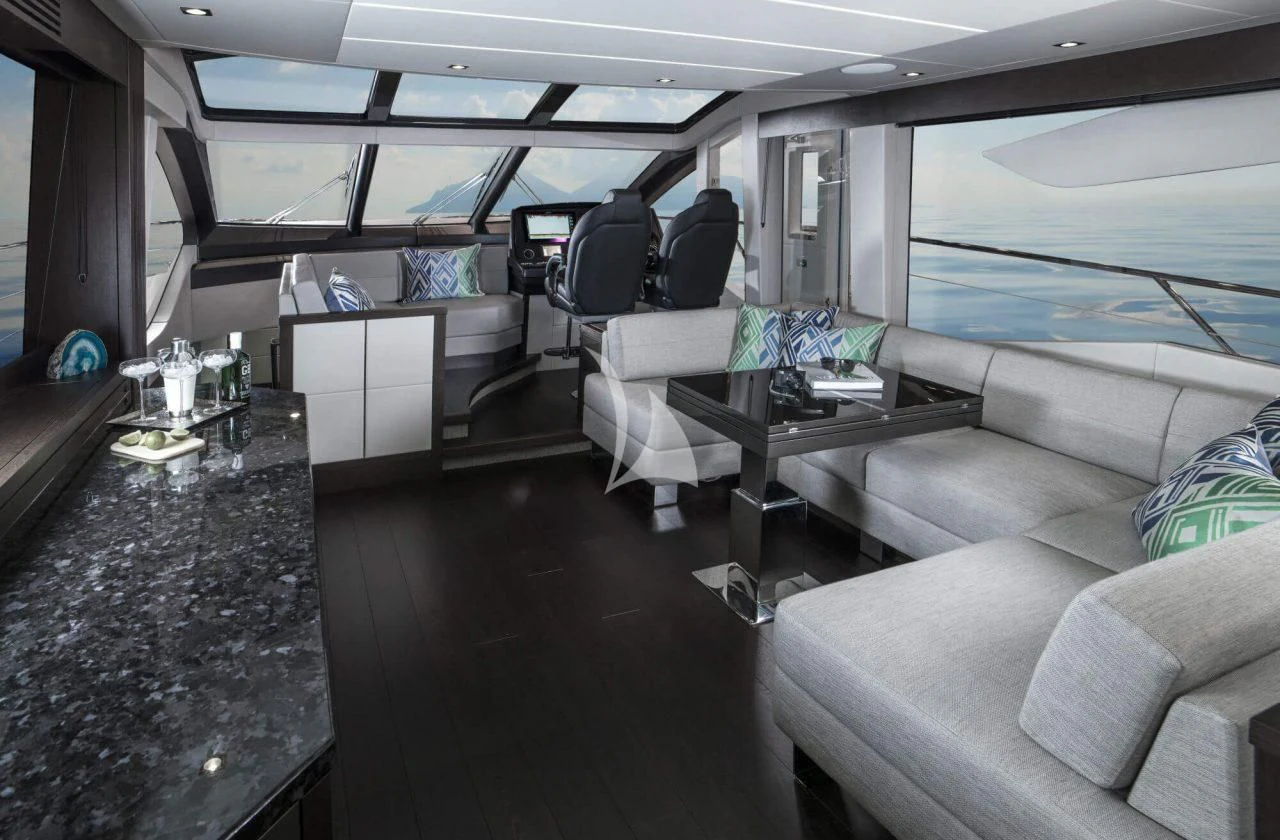 inside of a vehicle with a table and chairs aboard STRATEGIC DREAMS Yacht for Sale