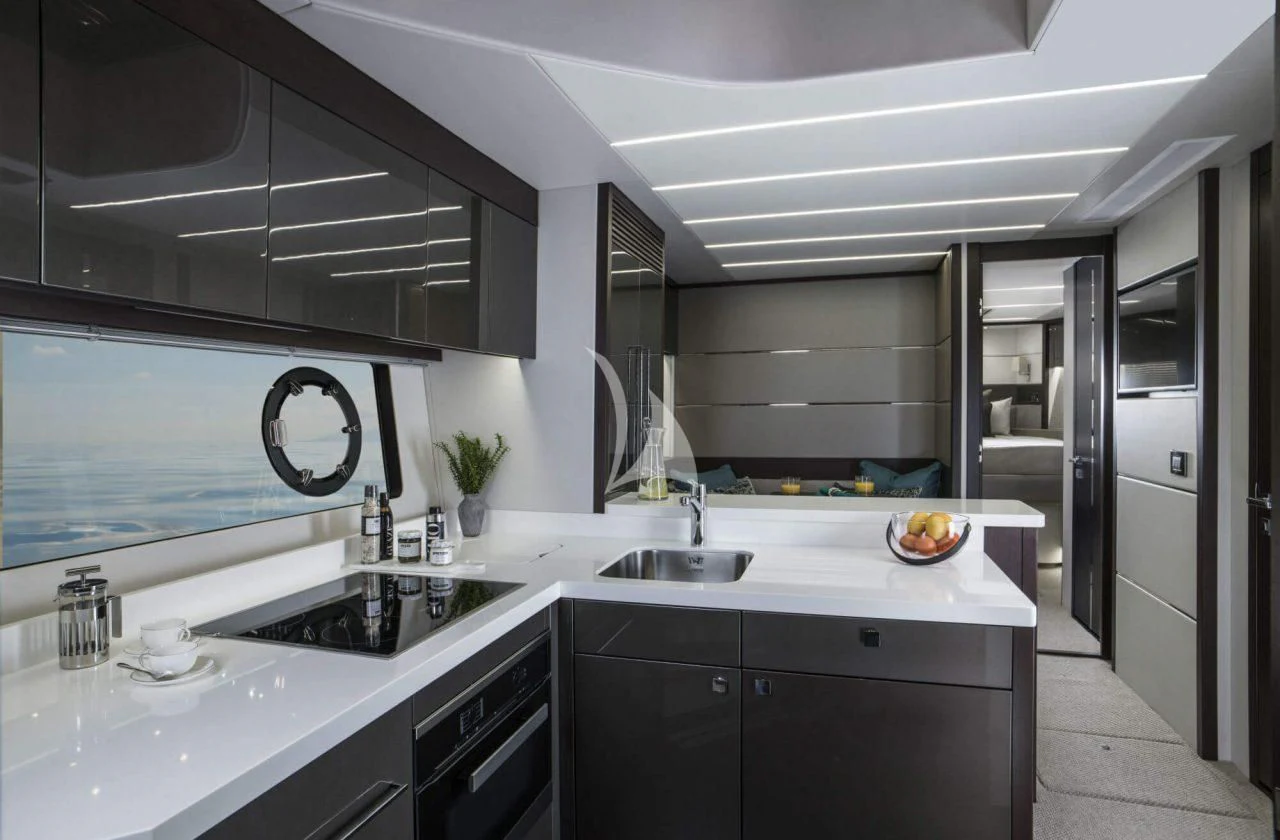 a kitchen with white cabinets aboard STRATEGIC DREAMS Yacht for Sale