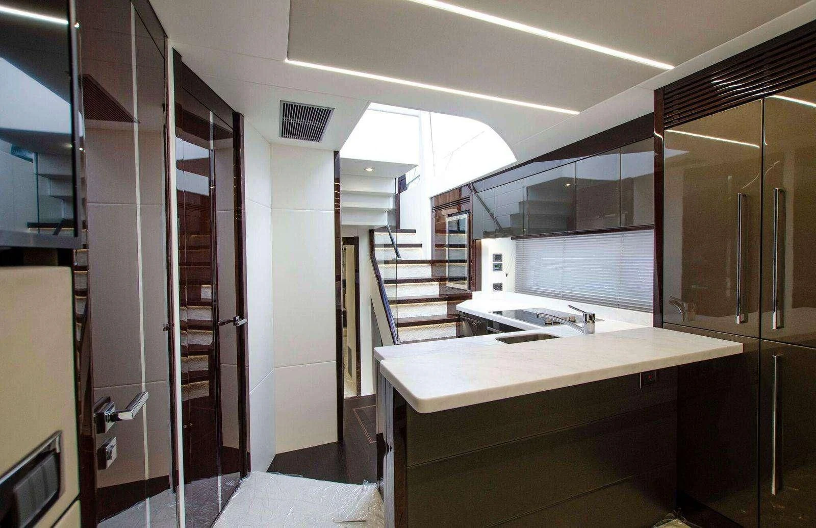 a room with a counter and cabinets aboard STRATEGIC DREAMS Yacht for Sale