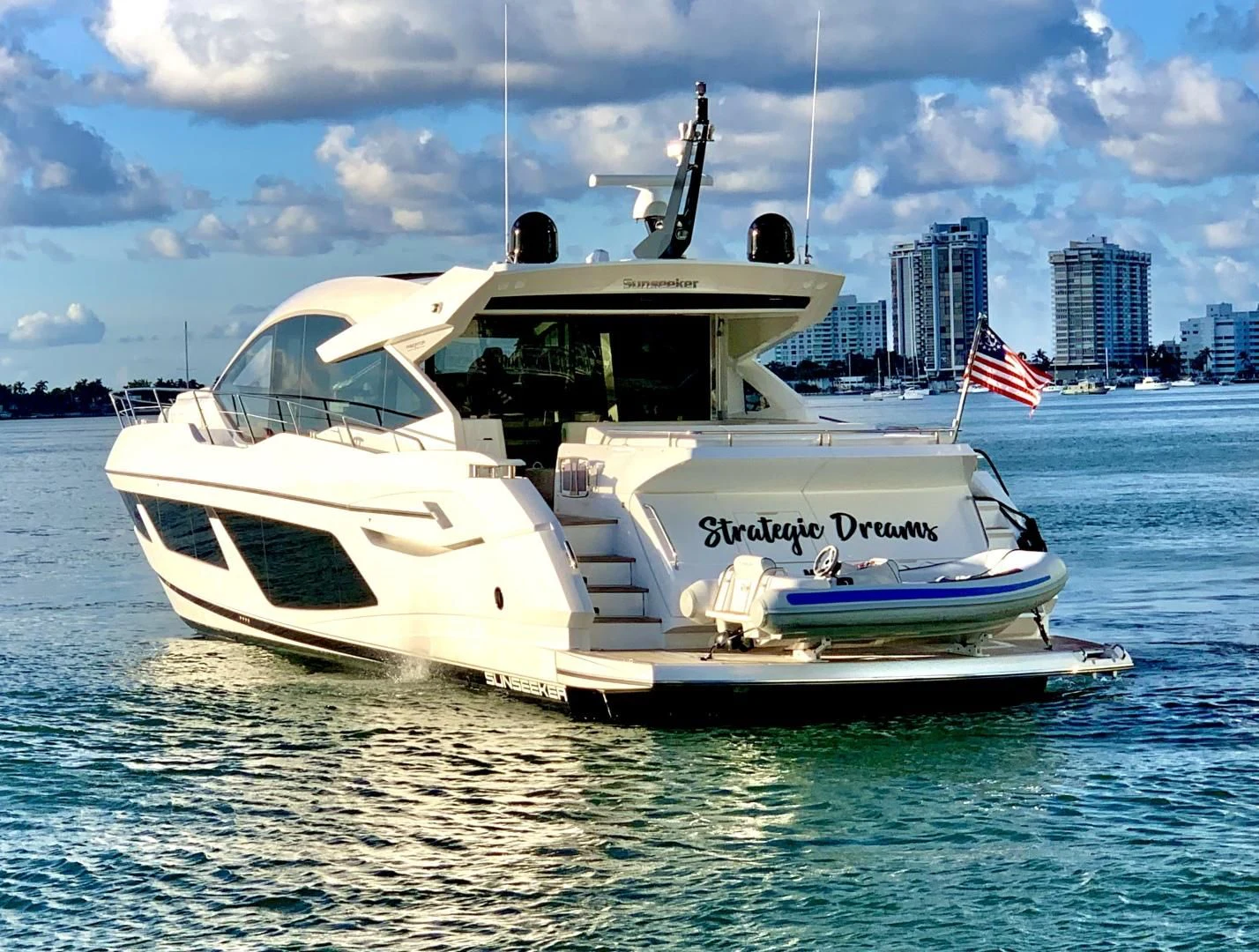 a white boat in the water aboard STRATEGIC DREAMS Yacht for Sale
