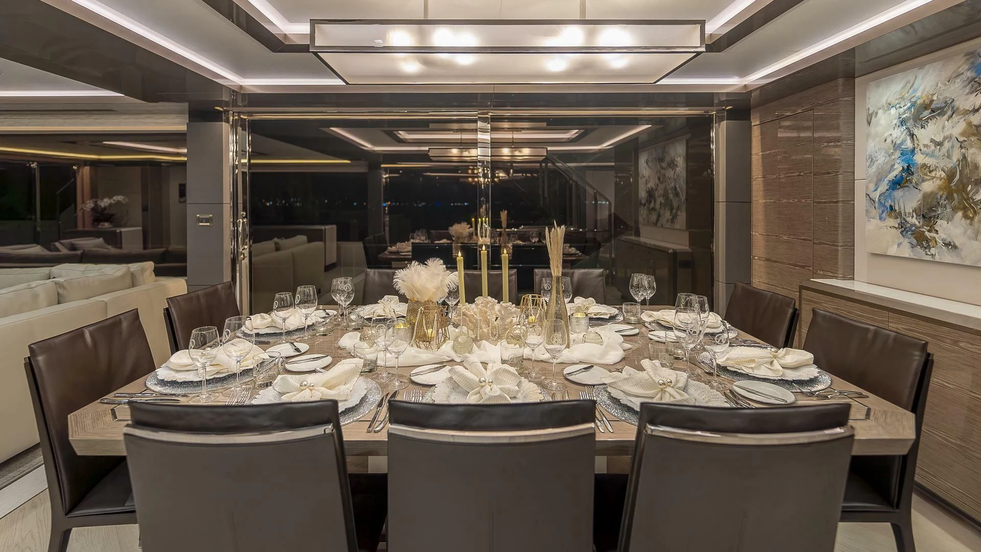 a table with plates and glasses aboard ENTREPRENEUR Yacht for Charter