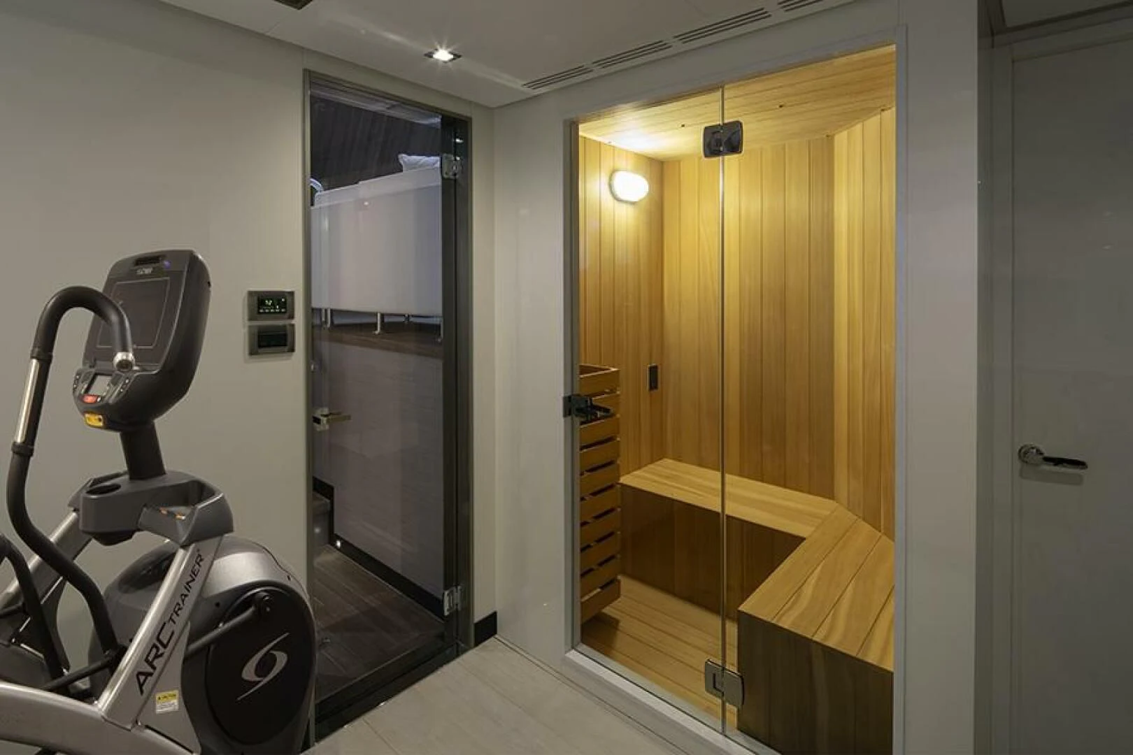 a room with a large mirror and a bike rack aboard ENTREPRENEUR Yacht for Charter