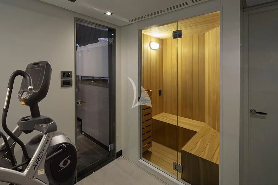 a room with a bike and a door aboard ENTREPRENEUR Yacht for Charter