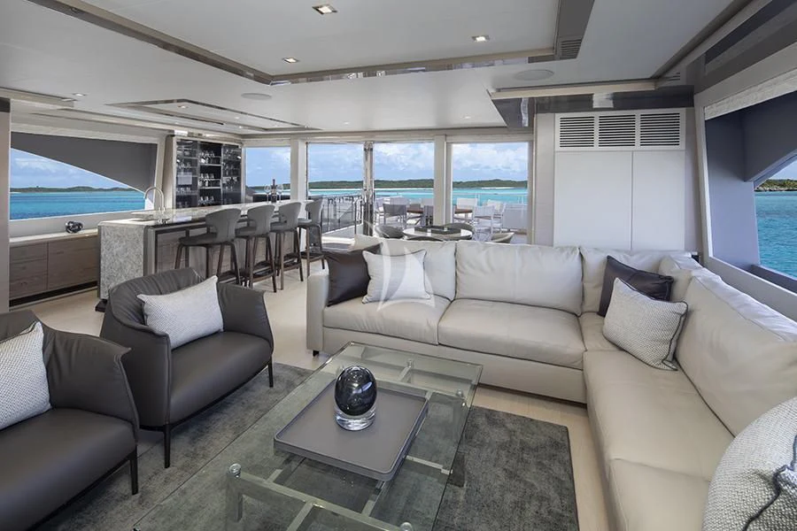 a living room with a large window aboard ENTREPRENEUR Yacht for Charter