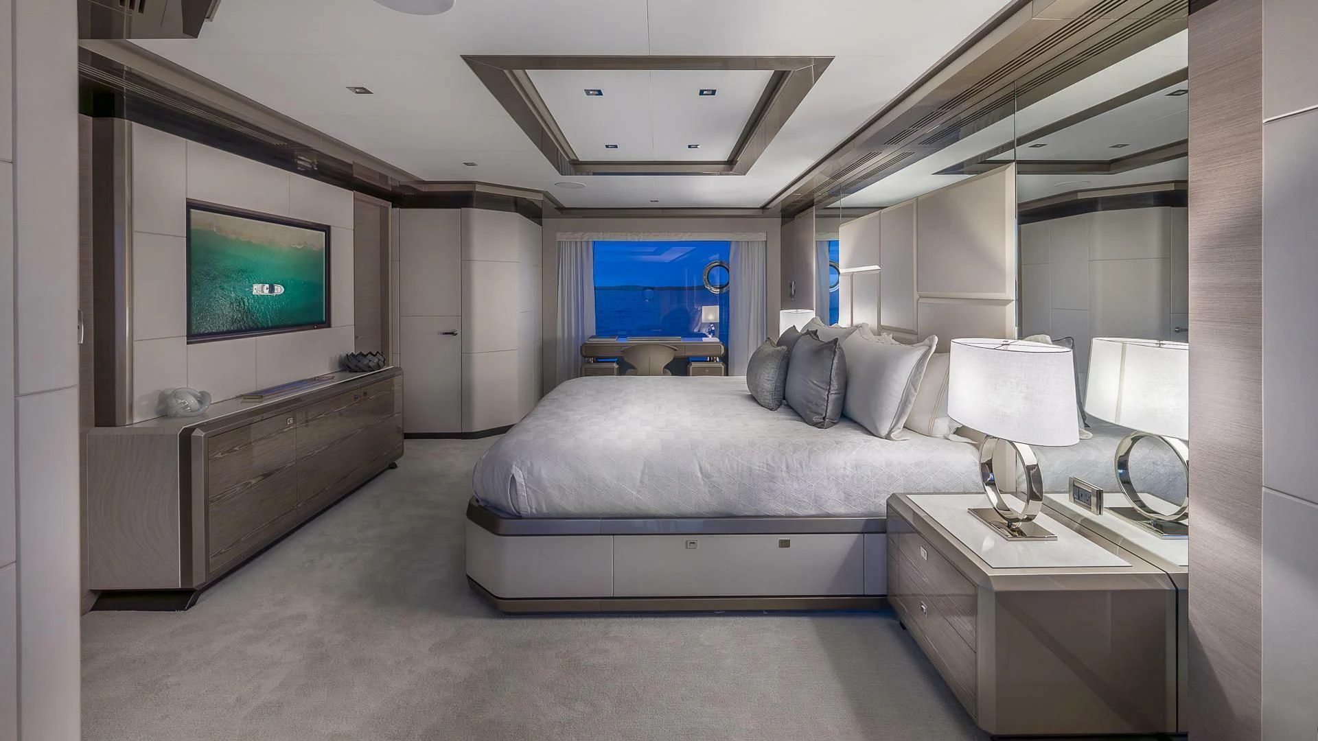 a bedroom with a bed and a tv aboard ENTREPRENEUR Yacht for Charter