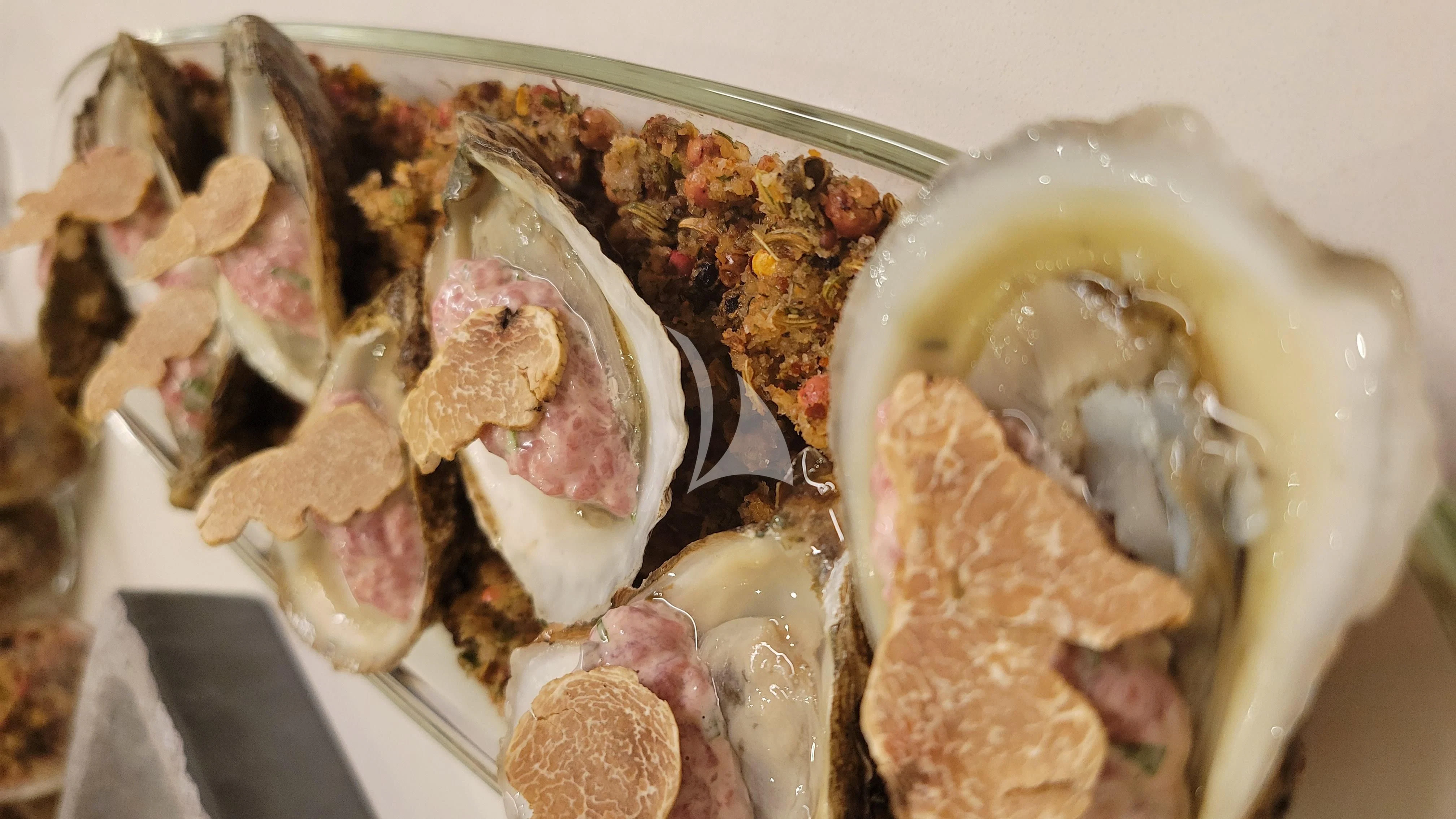 a plate of food aboard ENTREPRENEUR Yacht for Charter