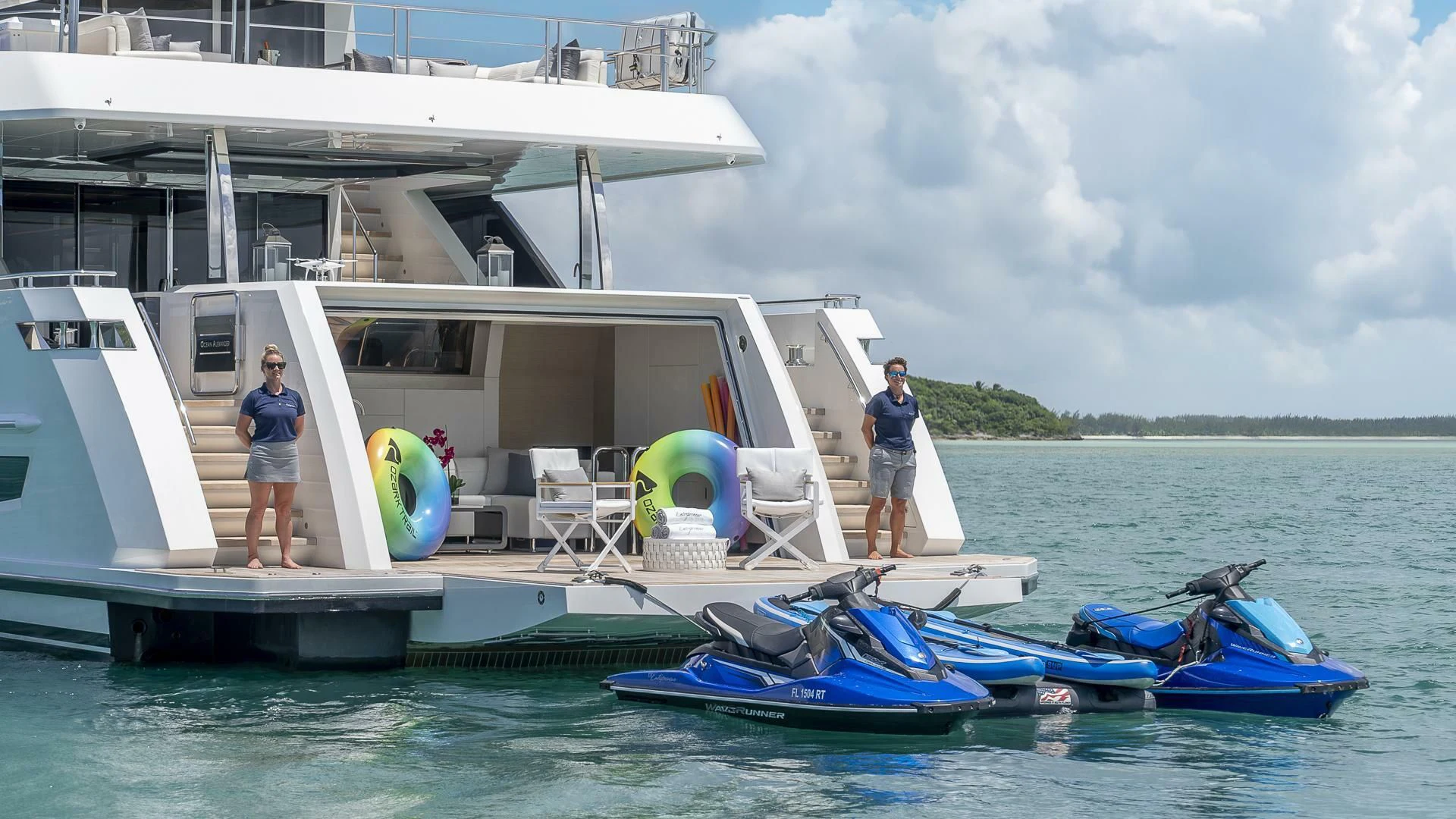 a couple of people standing on a boat in the water aboard ENTREPRENEUR Yacht for Charter