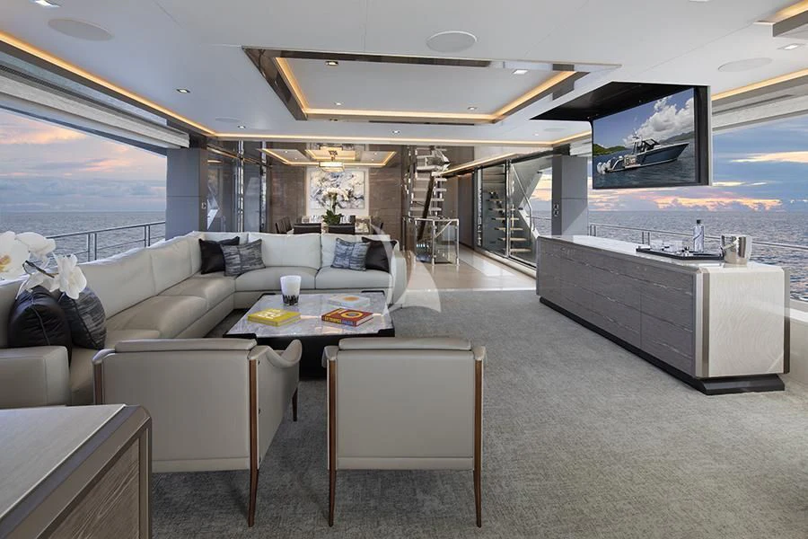 a living room with a large screen aboard ENTREPRENEUR Yacht for Charter